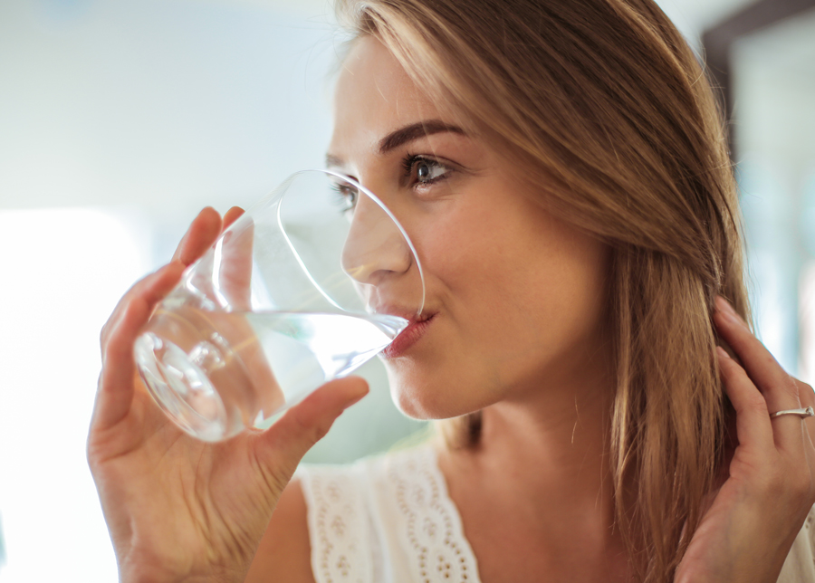 Woman drinking water from a glass