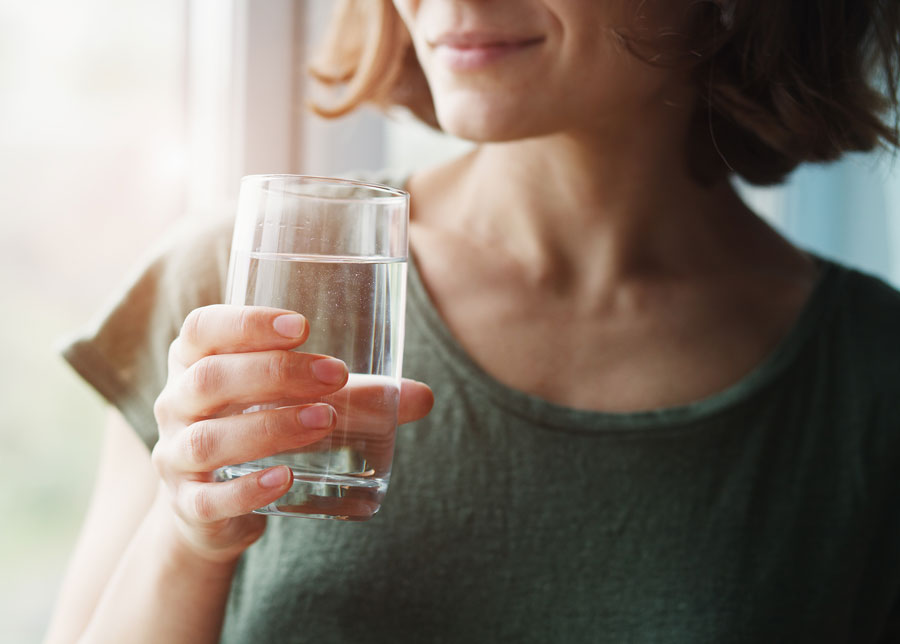Woman drinking water from a glass